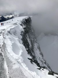 Scenic view of snow covered mountains against sky