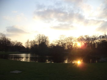 Scenic view of lake against sky during sunset