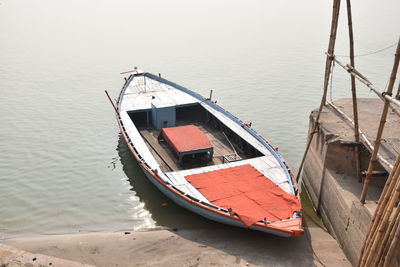 High angle view of sailboat moored in sea