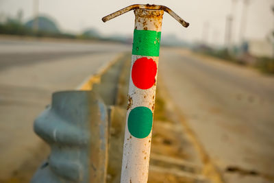 Close-up of road sign on street