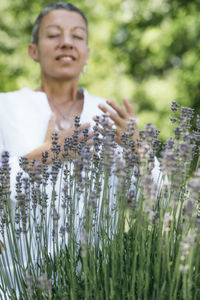 Woman smelling lavender flowers