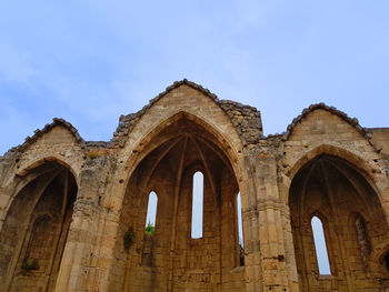 Low angle view of old building against sky