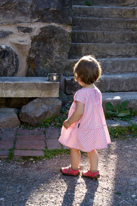 Full length of girl standing outdoors