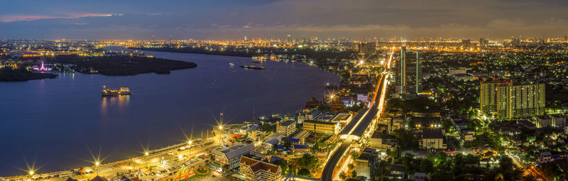 High angle view of illuminated buildings in city at night