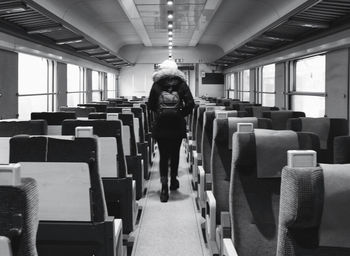 Full length portrait of man sitting in bus