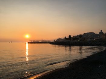 Scenic view of sea against sky during sunset