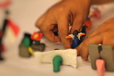 Close-up of human hand working with clay