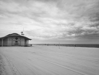 Scenic view of beach by sea against sky