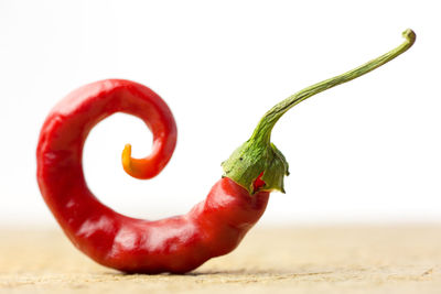 Close-up of red chili peppers on table