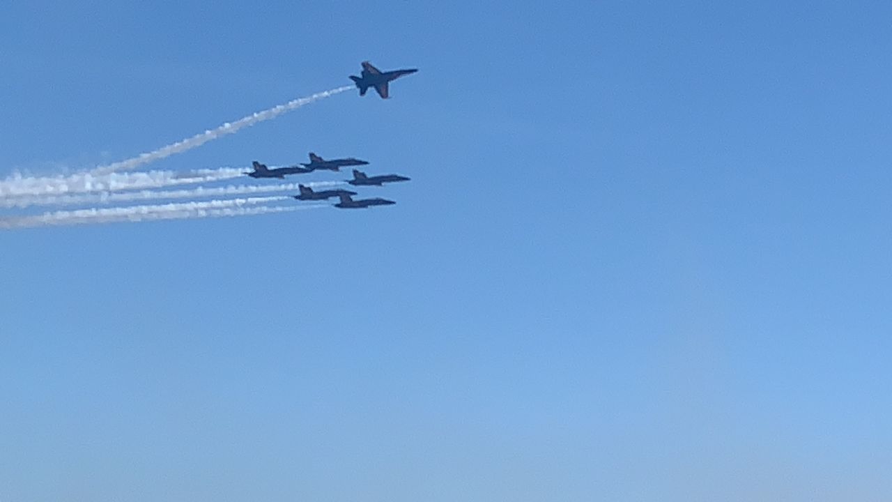 LOW ANGLE VIEW OF AIRSHOW AGAINST CLEAR SKY