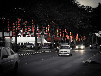 Cars on road in city at night