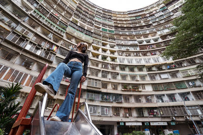Low angle view of people on building