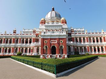 Facade of historic building against clear sky