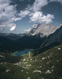 Scenic view of mountains against cloudy sky