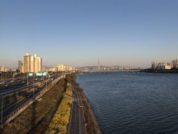 Panoramic view of river and buildings against clear sky