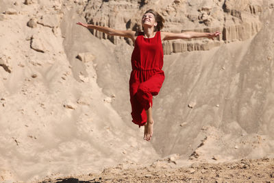 Full length of woman walking on beach