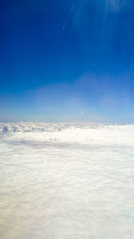 Scenic view of sea against blue sky