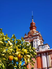 Low angle view of traditional building against clear blue sky