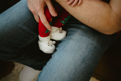 High angle view of person carrying baby 