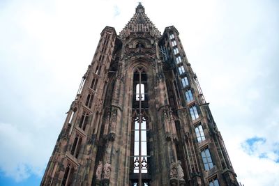 Low angle view of historic cathedral against cloudy sky