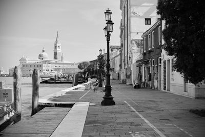 View of street amidst buildings in city