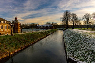 View of a well-preserved castle surrounded by a moat