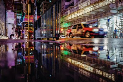 Cars on road in city at night