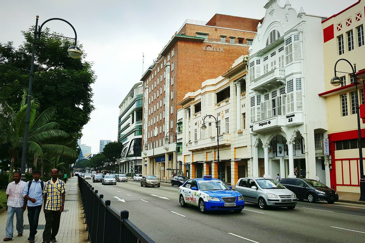 building exterior, architecture, built structure, street, car, transportation, land vehicle, city, road, mode of transport, residential structure, residential building, building, incidental people, city life, day, house, sky, outdoors