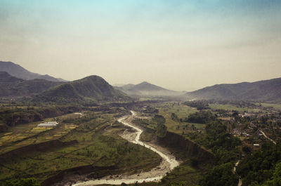 Aerial view of agricultural landscape against sky
