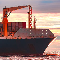 Low angle view of ship against sky during sunset