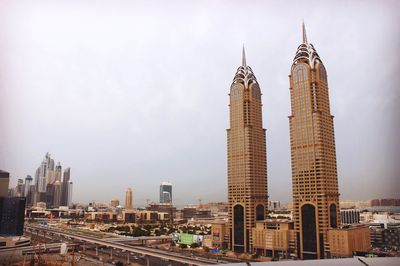 View of tall buildings against clear sky