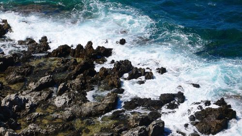 Waves splashing on rocks