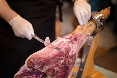 Midsection of man preparing food