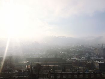 Sun shining over city
