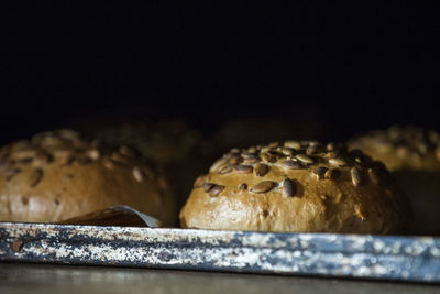 Close-up of bread on black background