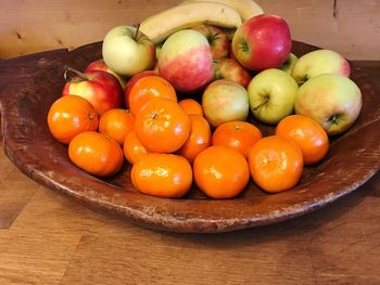 Fruits in plate on table