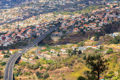 High angle view of street amidst buildings in town