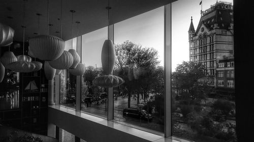 Panoramic shot of buildings seen through glass window