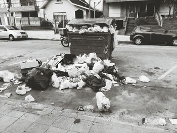 Garbage on sidewalk in city