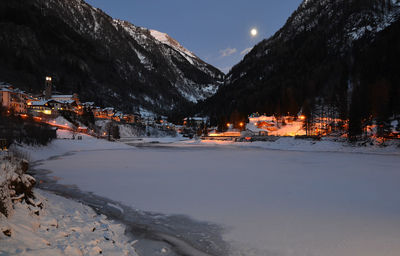 Scenic view of snowcapped mountains against sky at night