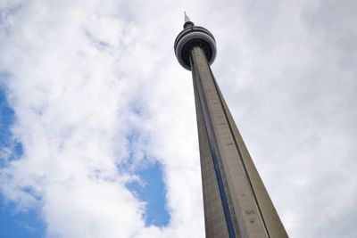 Low angle view of tower and building against sky