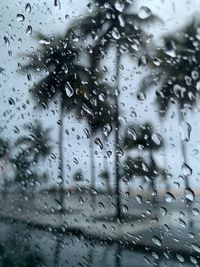 Full frame shot of wet glass window in rainy season