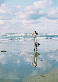 Full length of man standing on beach