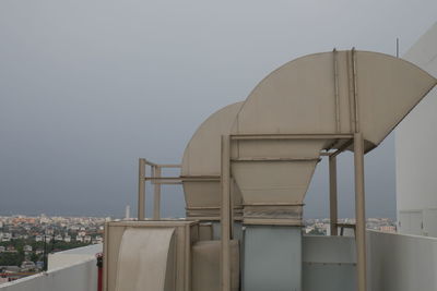 Air ducts on building against clear sky