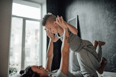 Young couple sitting on table at home