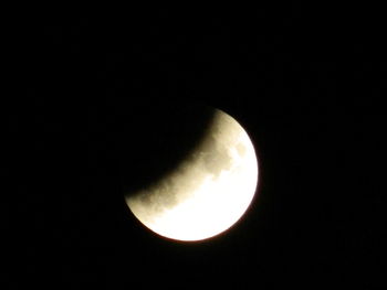 Low angle view of moon against sky at night