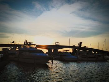 View of harbor at sunset