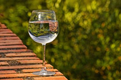 Close-up of water in wineglass on table