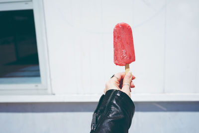 Midsection of woman holding ice cream