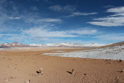 Scenic view of desert and mountains against sky - bolivia